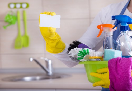 Professional cleaner working in a London apartment living room