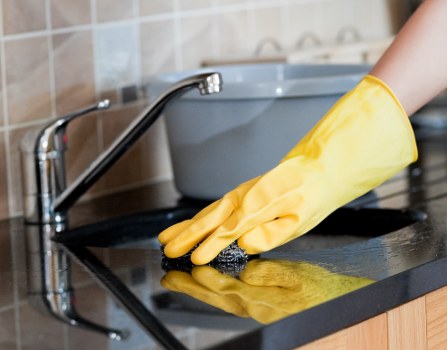 Domestic cleaner working in a modern London flat