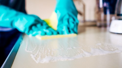 Flat cleaning team applying hygiene and environmental care measures